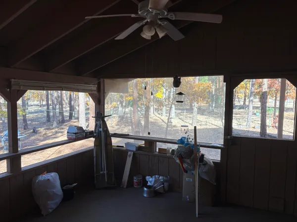 a kitchen with a sink cabinets and wooden floor