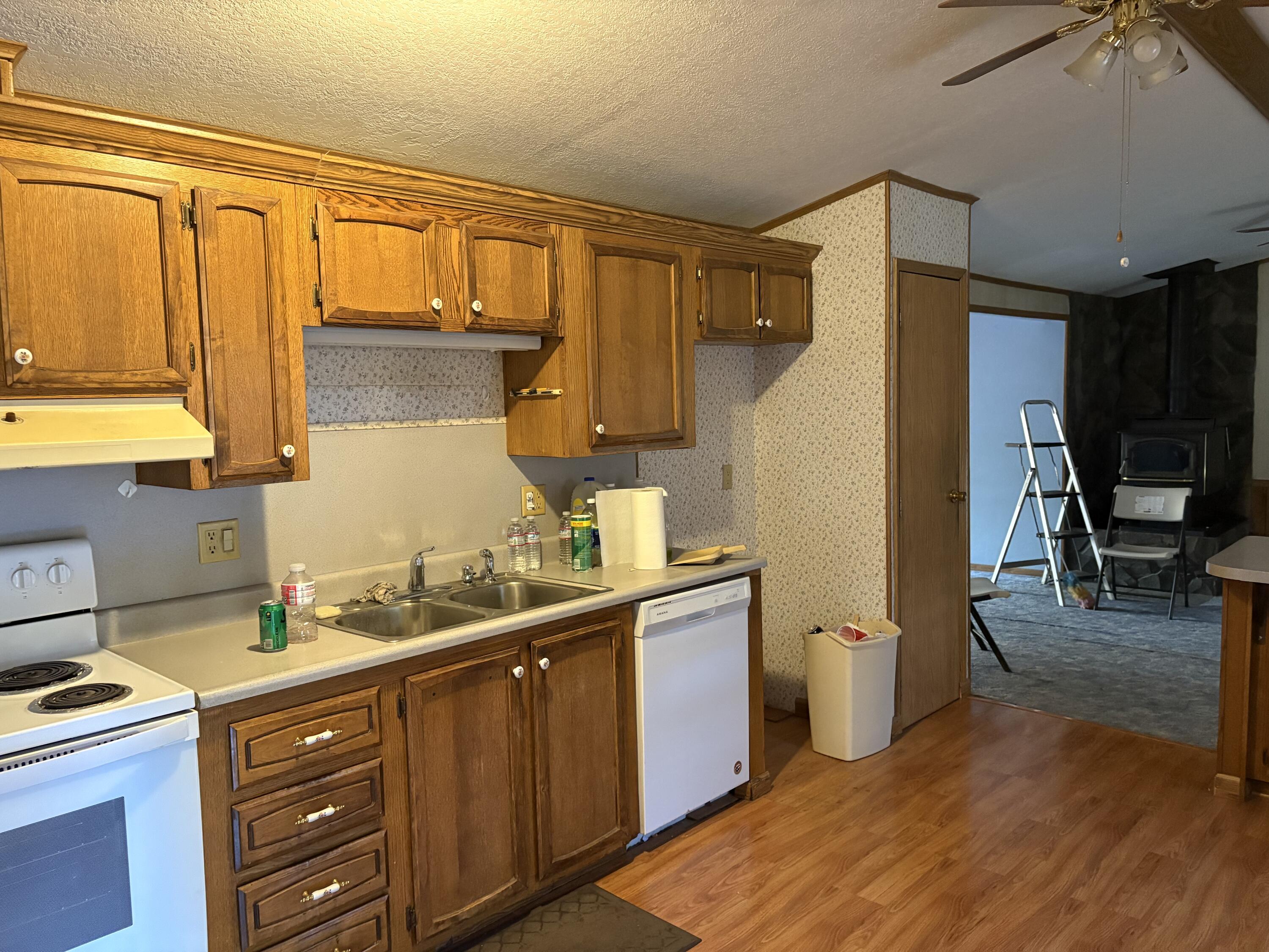 29372 Day Road McArthur, CA 96056 - Photo 14 of 29 a kitchen with a sink cabinets and wooden floor