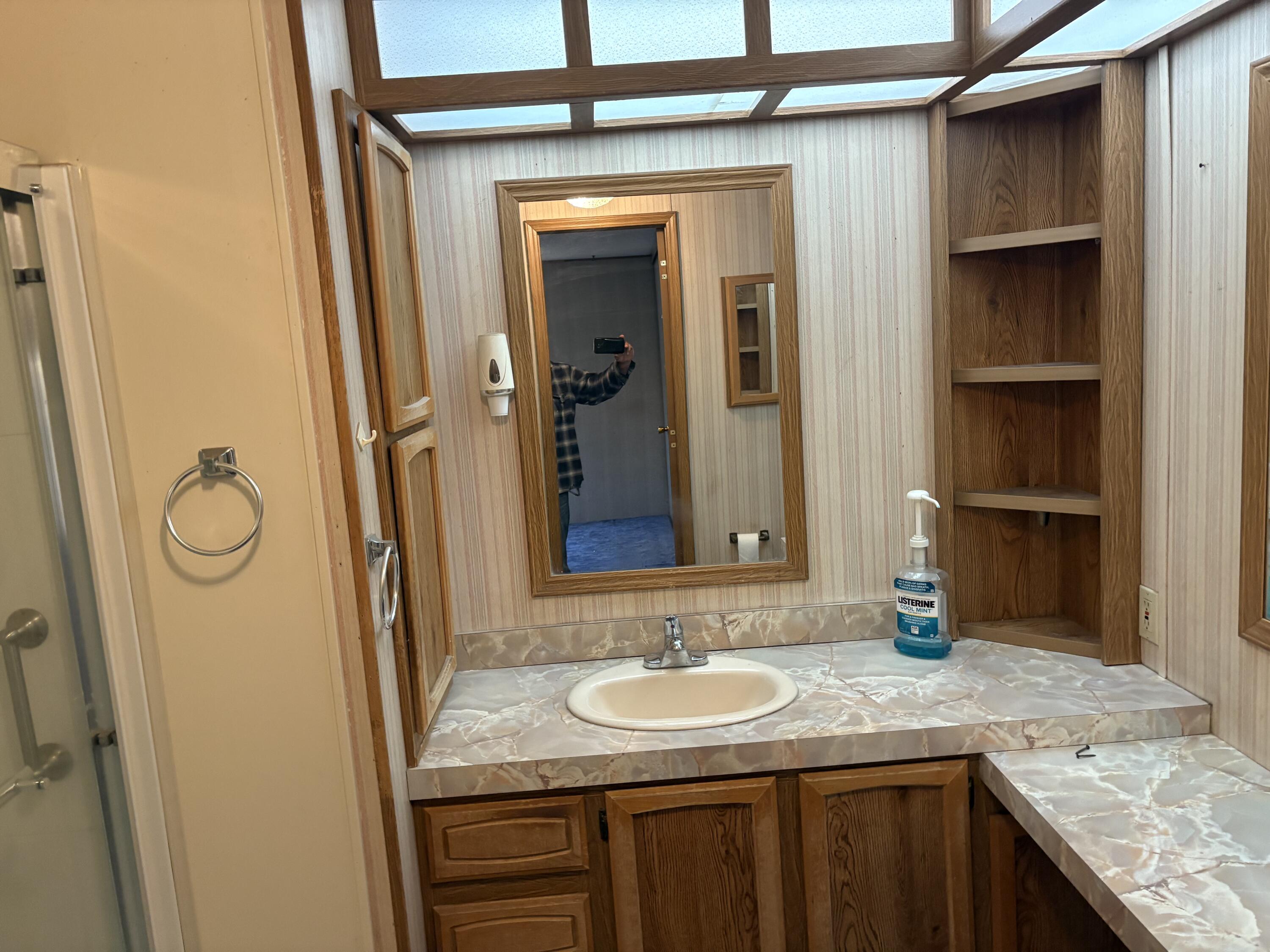 29372 Day Road McArthur, CA 96056 - Photo 28 of 29 a bathroom with a granite countertop sink and a mirror