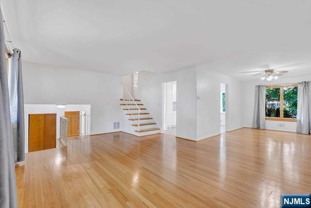 516 Knickerbocker Road Cresskill, NJ 07626 - Photo 15 of 31 a view of an empty room with wooden floor and a window