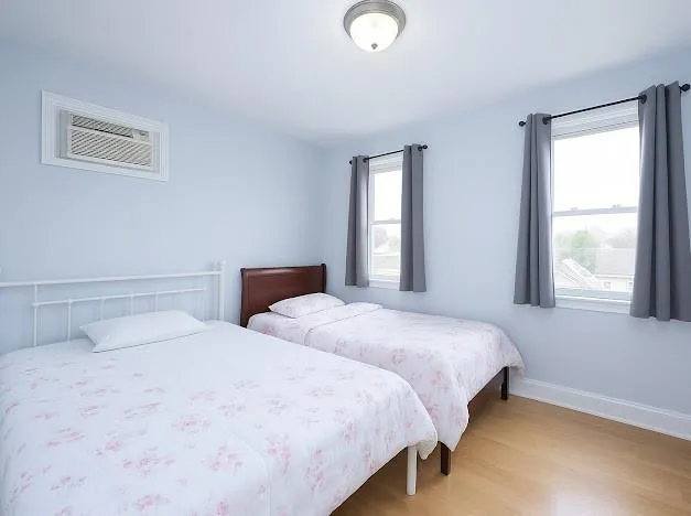 a bedroom with a bed and flat screen tv