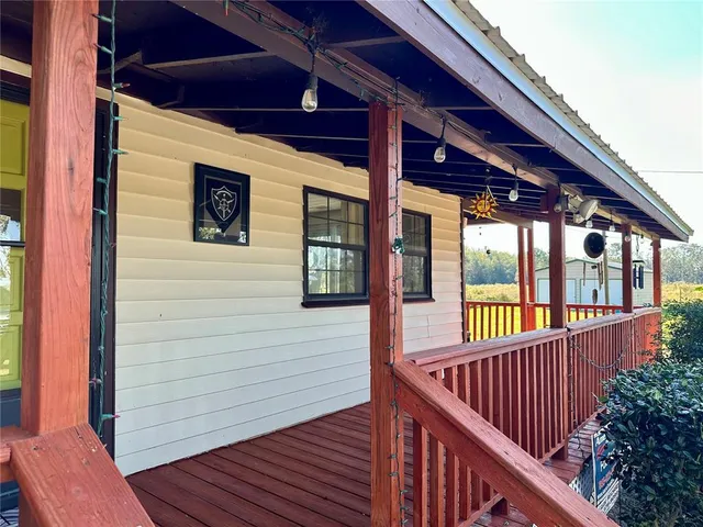 a view of balcony with wooden floor