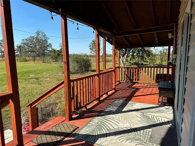 a view of two chairs in the balcony