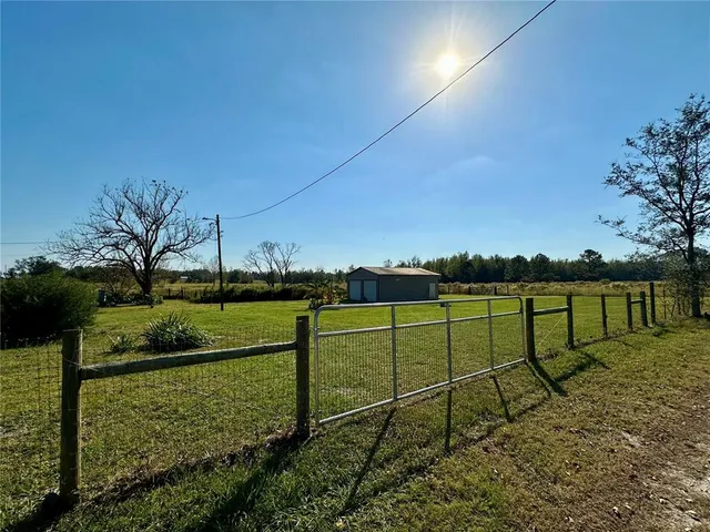 a view of a garden with an chairs
