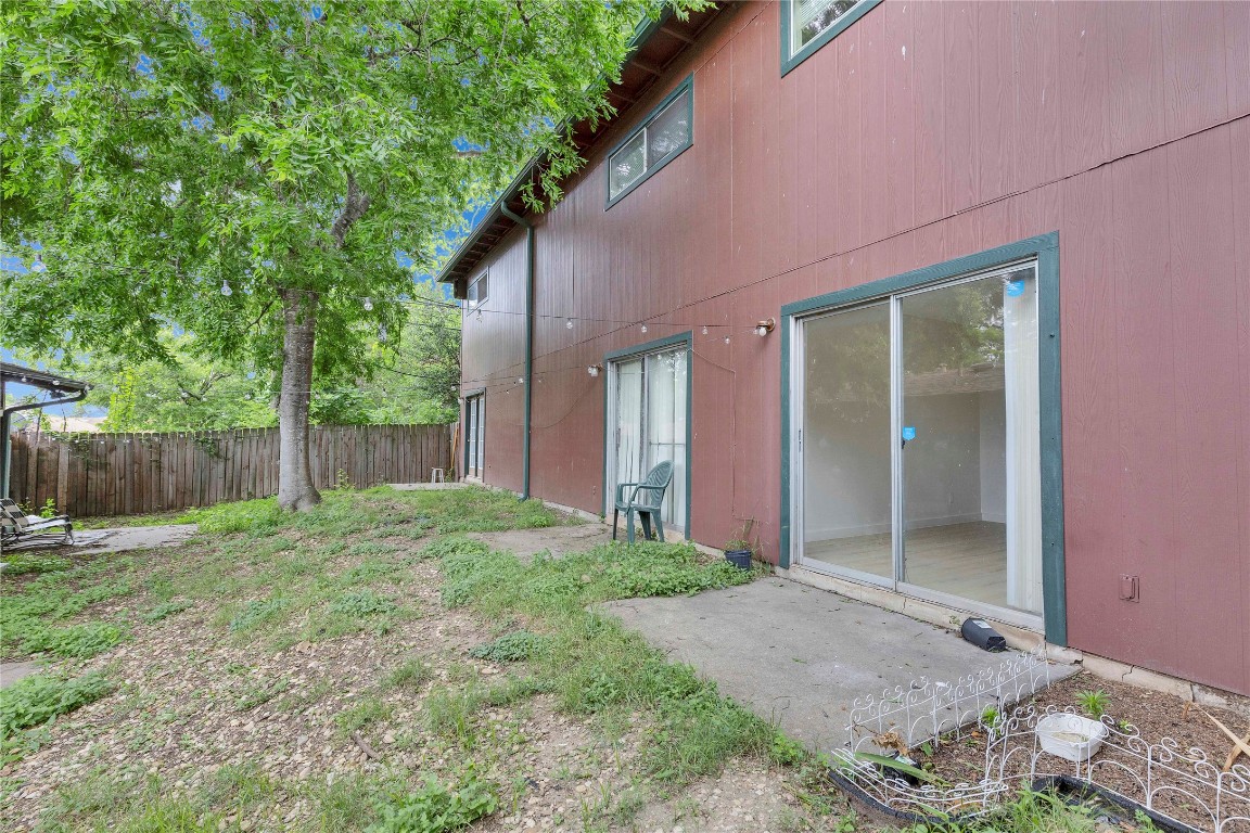 2314 Greenfield Parkway, Unit 108 Austin, TX 78741 - Photo 12 of 23 a view of a backyard with plants and large trees