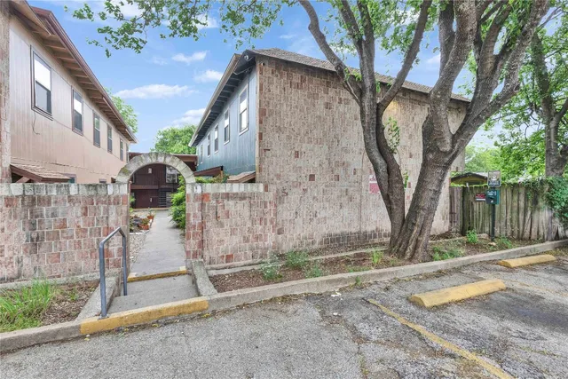 a view of a car is parked in front of a house