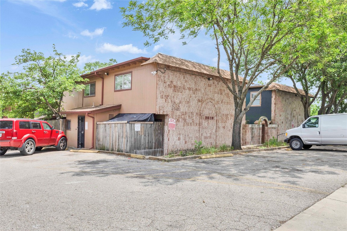 2314 Greenfield Parkway, Unit 108 Austin, TX 78741 - Photo 21 of 23 a view of a car is parked in front of a house