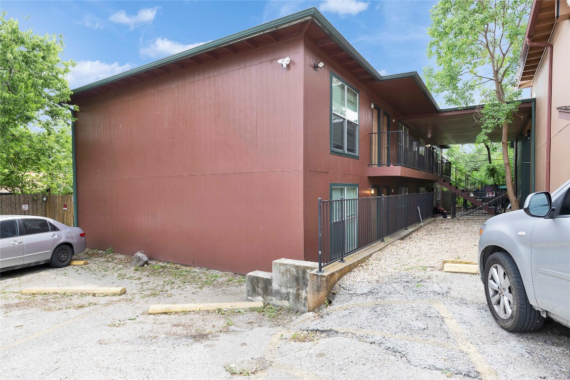 2314 Greenfield Parkway, Unit 108 Austin, TX 78741 - Photo 23 of 23 a backyard of a house with a fire pit and outdoor seating