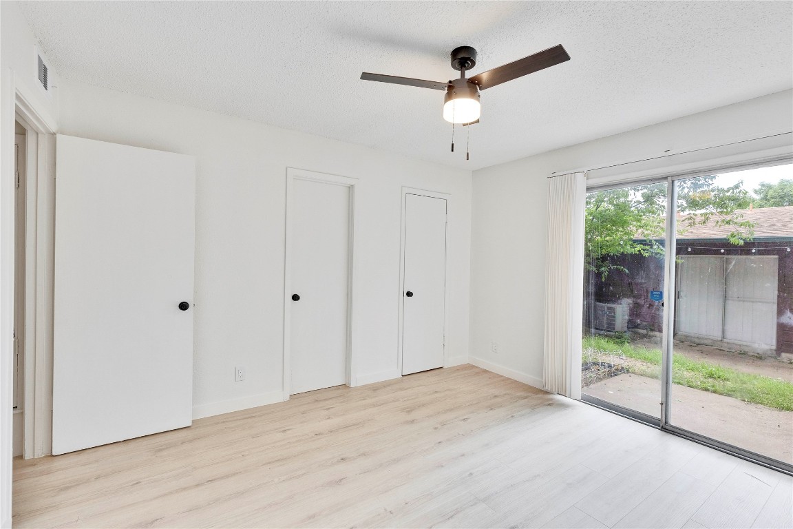 2314 Greenfield Parkway, Unit 108 Austin, TX 78741 - Photo 4 of 23 a view of a livingroom with a ceiling fan and window