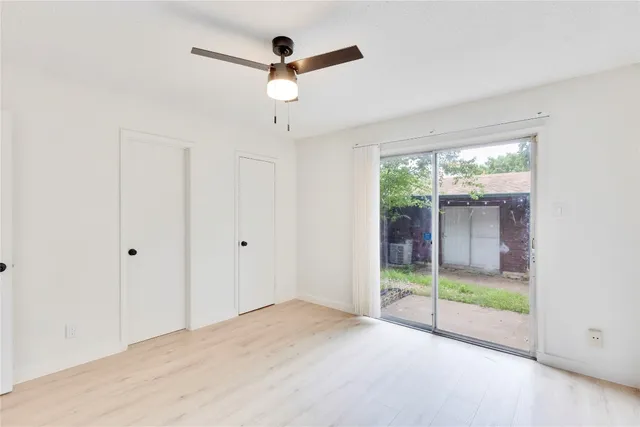 a view of an empty room with a balcony