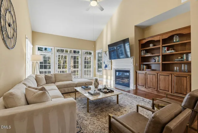 a kitchen with stainless steel appliances granite countertop a refrigerator a stove and a sink