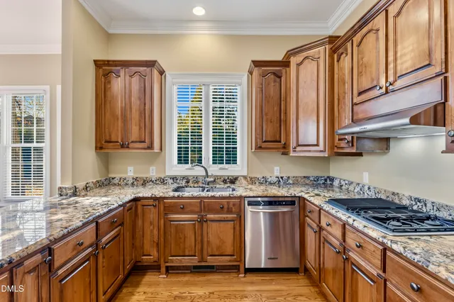 a bathroom with a granite countertop sink a large mirror and a bathtub