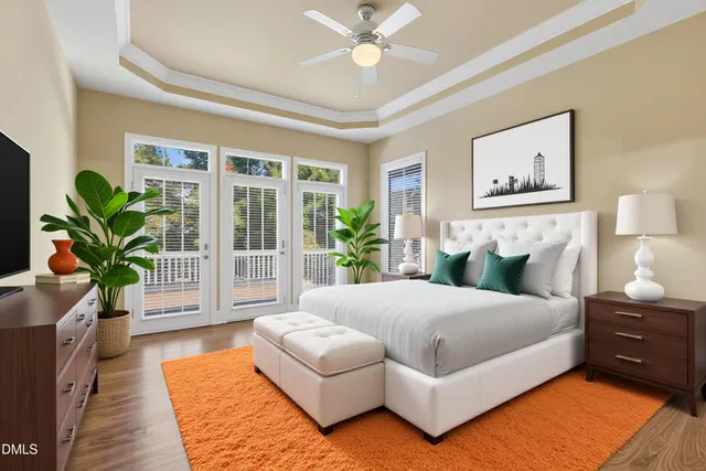 a bedroom with a bed and a chandelier