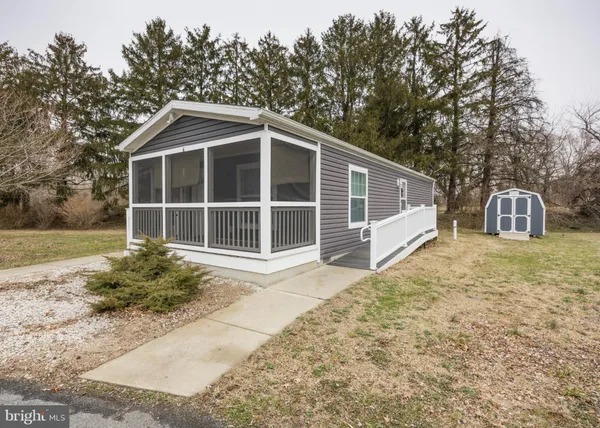 a house with trees in the background