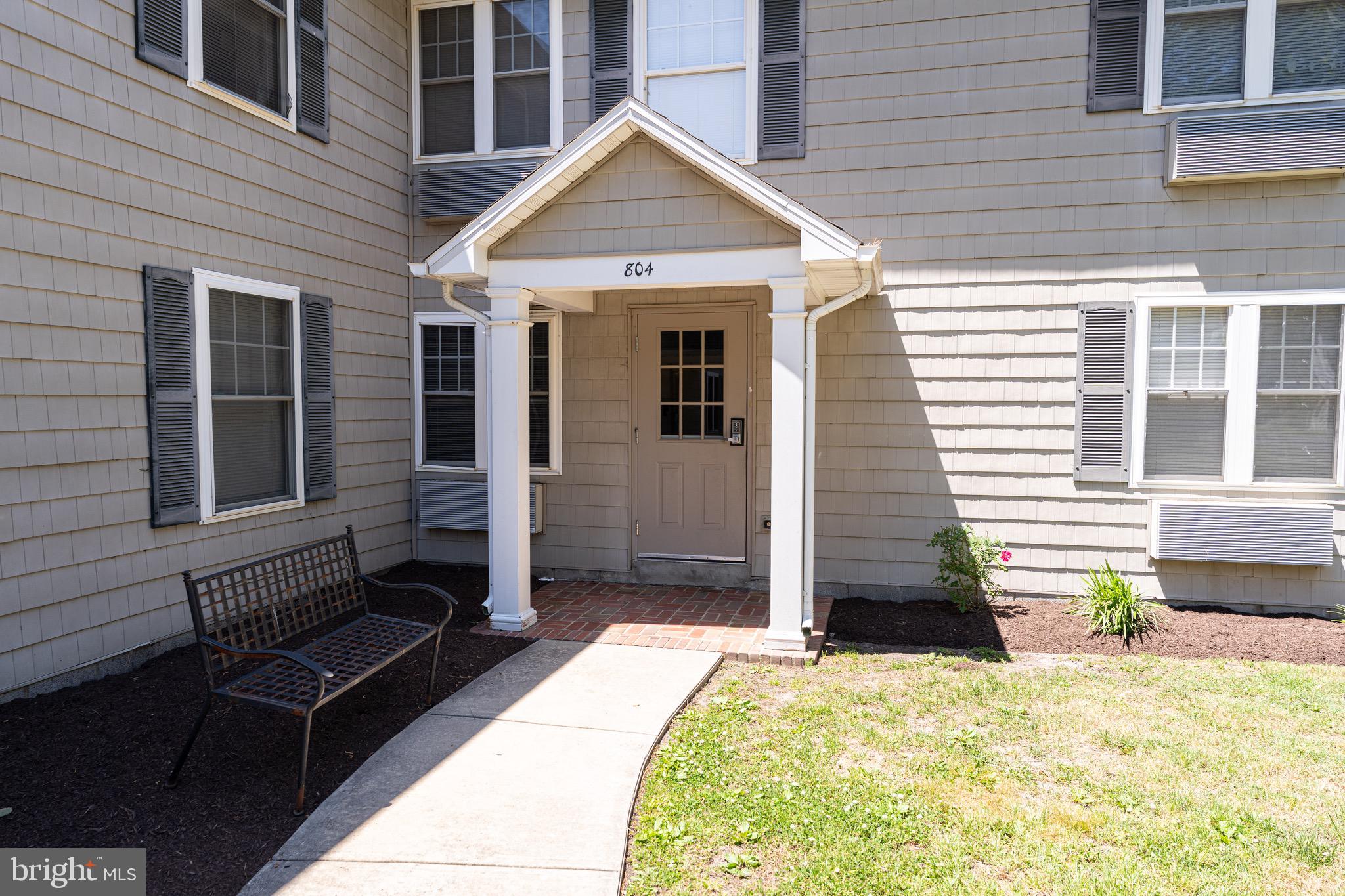 804 Travers Street, Unit 2 Cambridge, MD 21613 - Photo 1 of 26 a front view of a house with a outdoor space