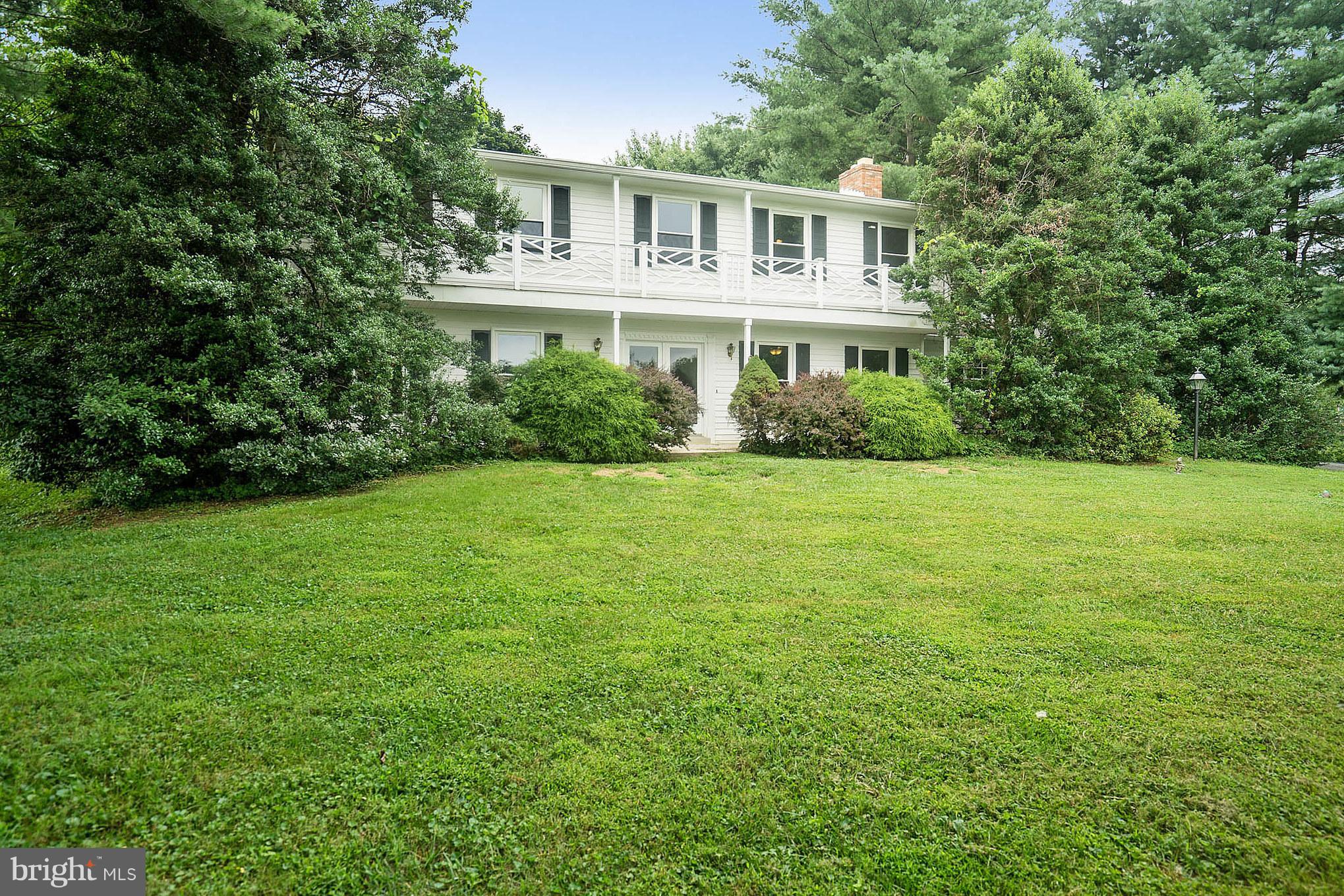 9448 Lovat Road Fulton, MD 20759 - Photo 4 of 30 a front view of a house with a garden