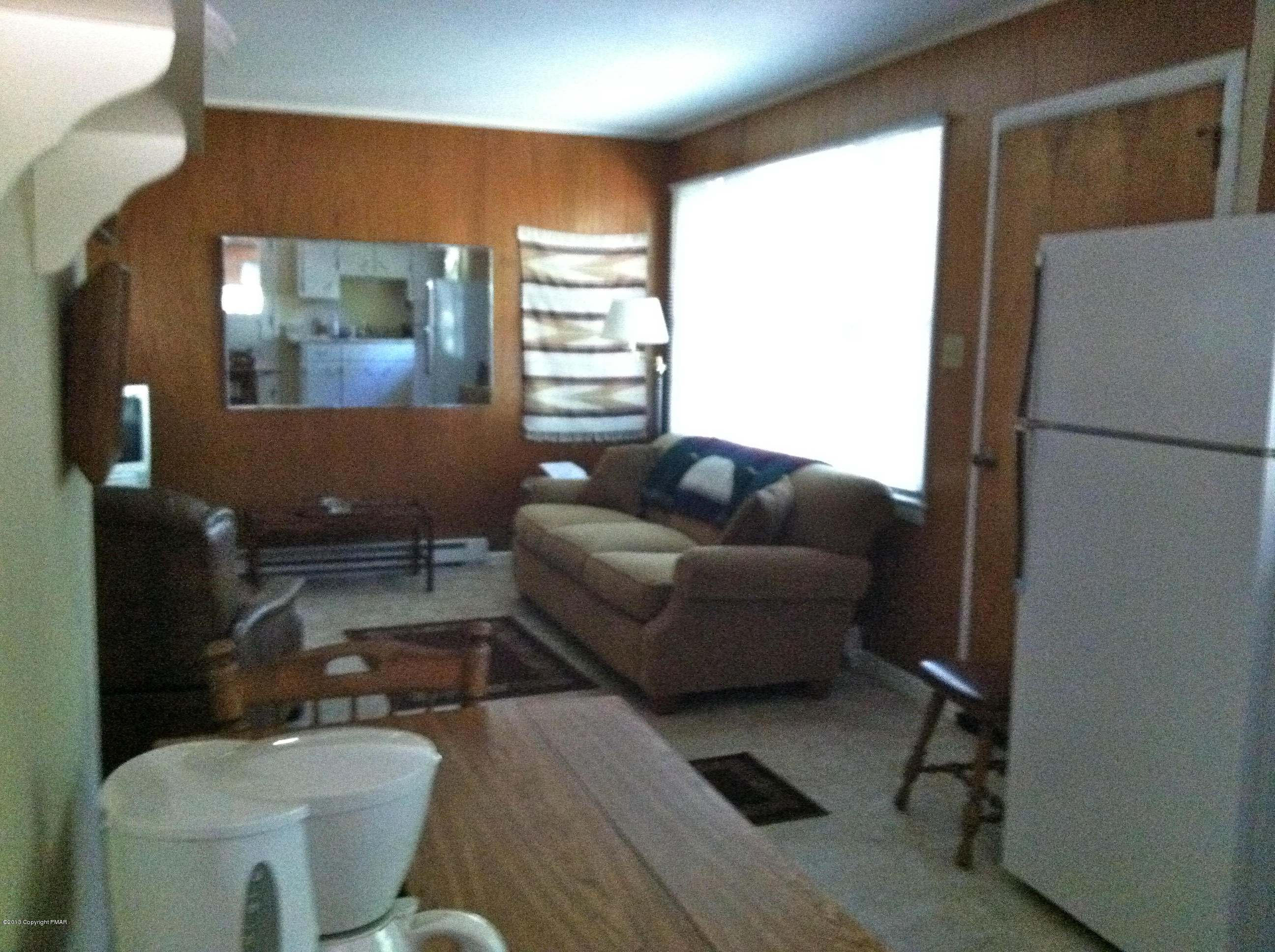6249 Laurel Road Pocono Summit, PA 18346 - Photo 7 of 14 a living room with furniture and a large window