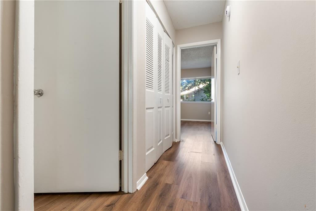 469 Granite Ridge Place Atlanta, GA 30350 - Photo 11 of 18 a view of a hallway with wooden floor