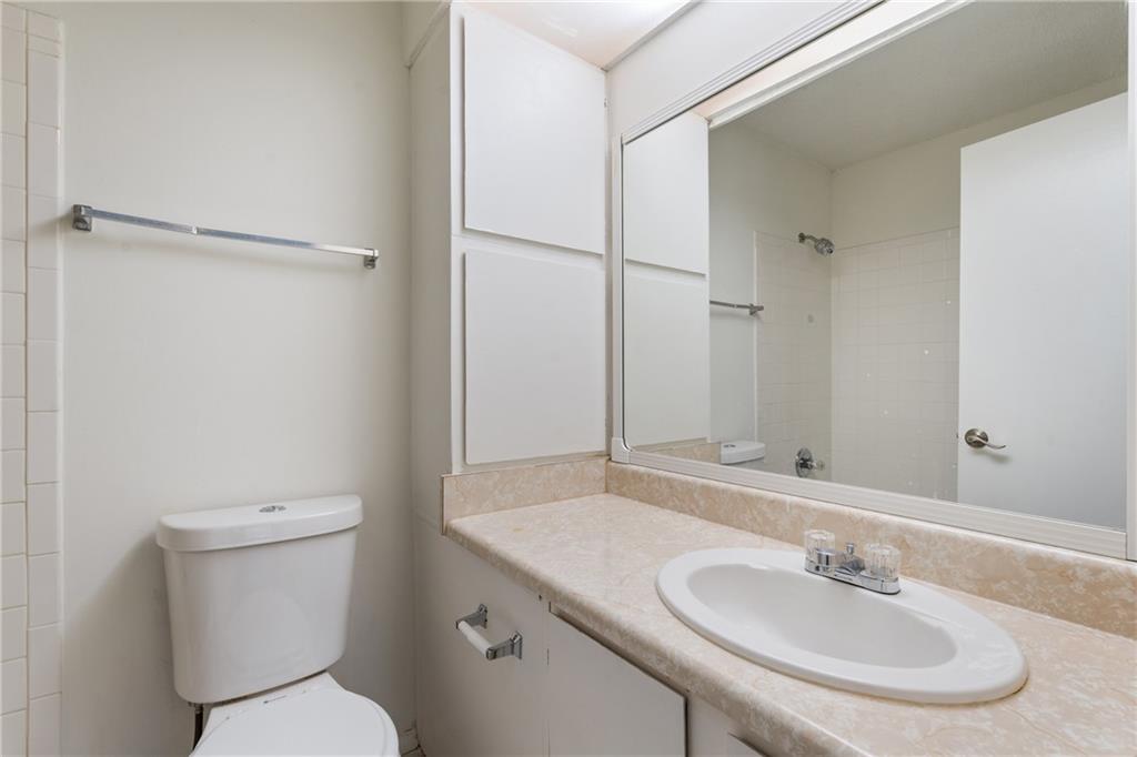 469 Granite Ridge Place Atlanta, GA 30350 - Photo 14 of 18 a bathroom with a sink toilet and a mirror