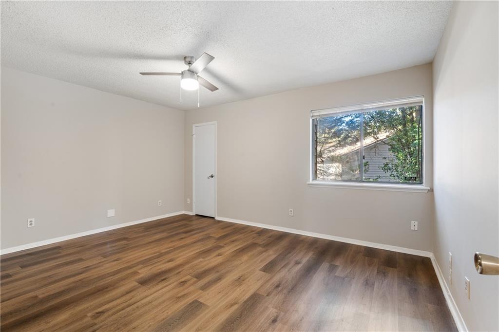 469 Granite Ridge Place Atlanta, GA 30350 - Photo 15 of 18 a view of an empty room with wooden floor and a window