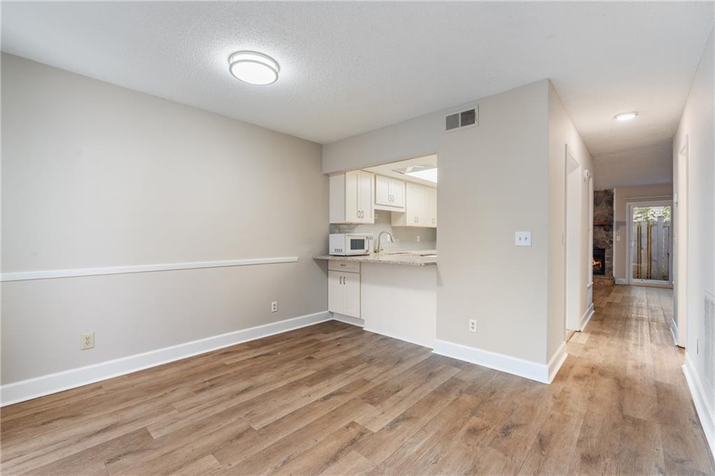469 Granite Ridge Place Atlanta, GA 30350 - Photo 9 of 18 a view of empty room with wooden floor