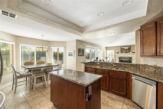 a view of a chairs and table on the roof deck