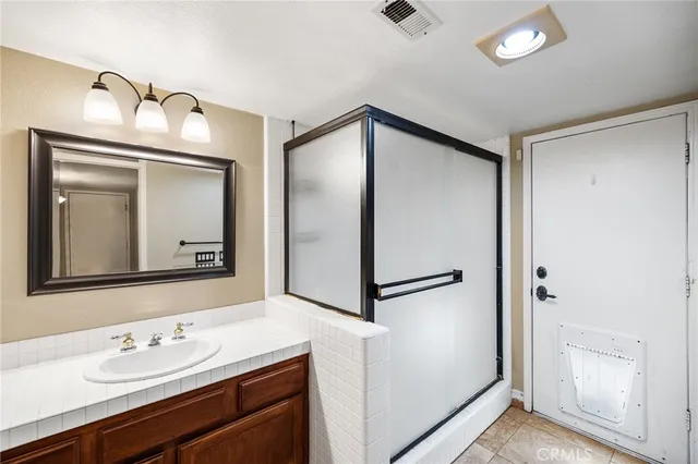 a spacious bathroom with a tub and sink