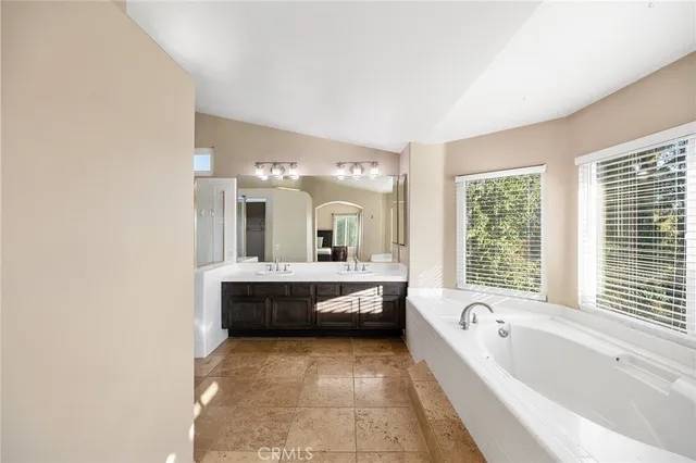 a view of a backyard with sitting area