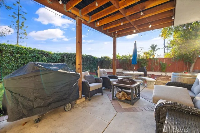 a view of a swimming pool with a yard and from a bench