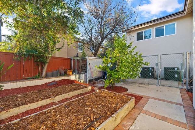a view of yard with swimming pool and outdoor seating