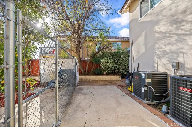 an aerial view of a house with a yard and garden