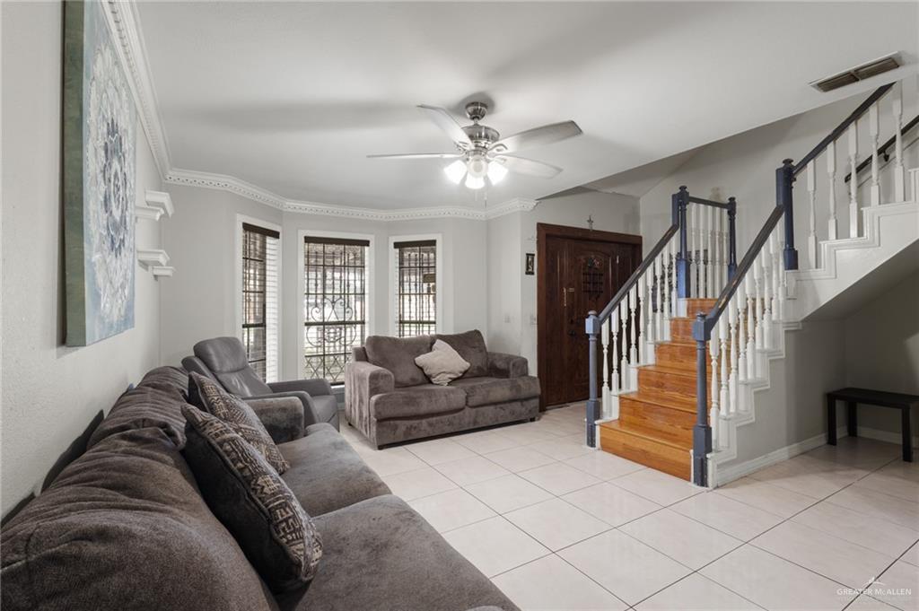 157 San Agustin Street Rio Grande City, TX 78582 - Photo 3 of 17 a living room with furniture and stairs