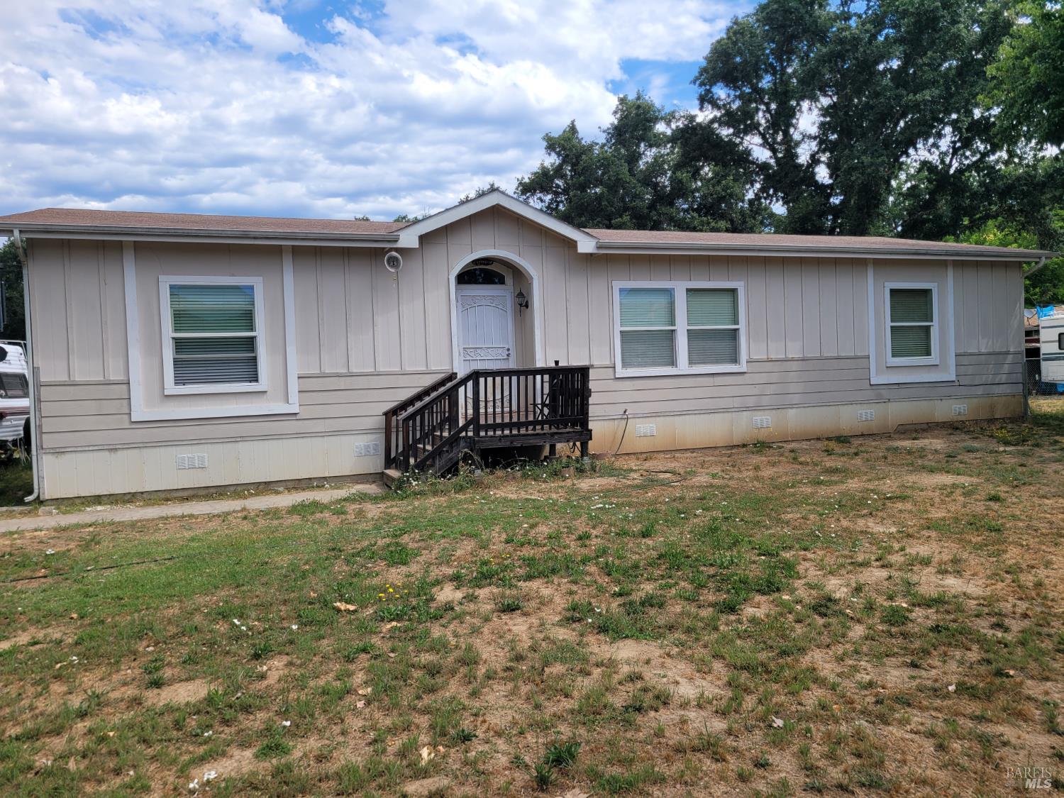 a house view with a garden space