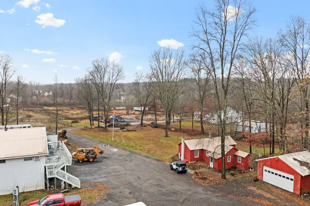 a bedroom with two beds and a dresser