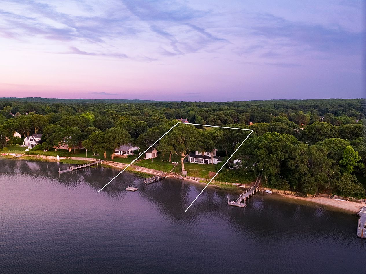a view of a swimming pool with a table and a fire pit