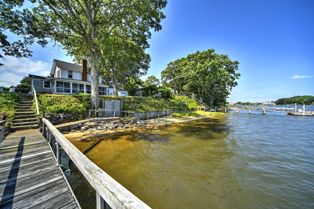 9 Bluff Point Lane Sag Harbor, NY 11963 - Photo 11 of 25 a view of a swimming pool with a patio