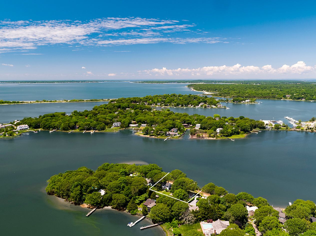 9 Bluff Point Lane Sag Harbor, NY 11963 - Photo 2 of 25 an aerial view of a houses with ocean view