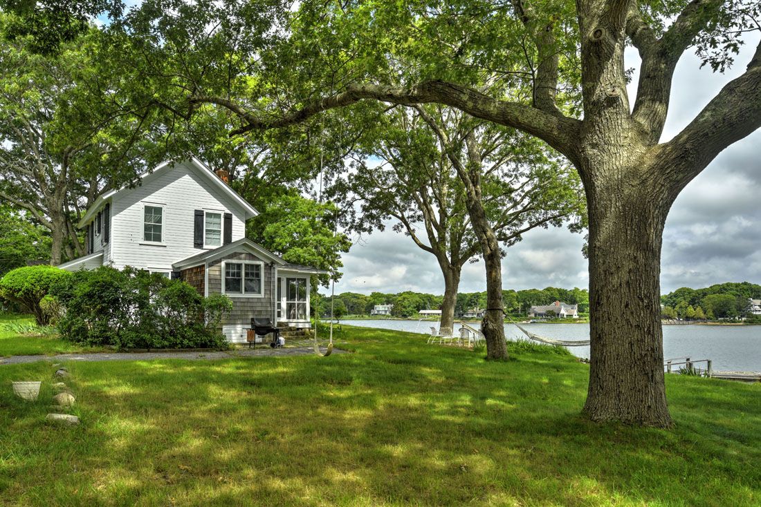 9 Bluff Point Lane Sag Harbor, NY 11963 - Photo 23 of 25 a front view of a house with garden
