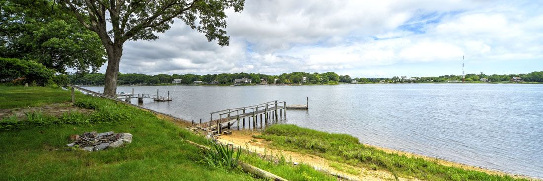 9 Bluff Point Lane Sag Harbor, NY 11963 - Photo 3 of 25 a view of lake with wooden floor and city view