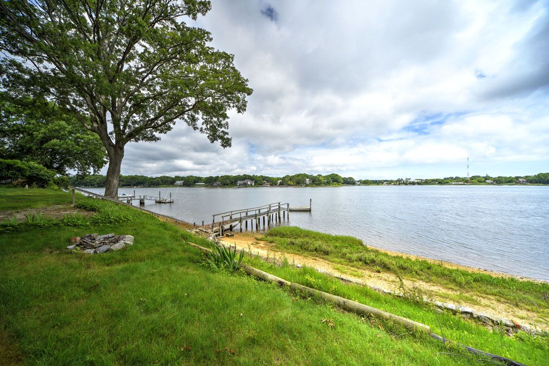 9 Bluff Point Lane Sag Harbor, NY 11963 - Photo 7 of 25 a view of a lake with houses in the back