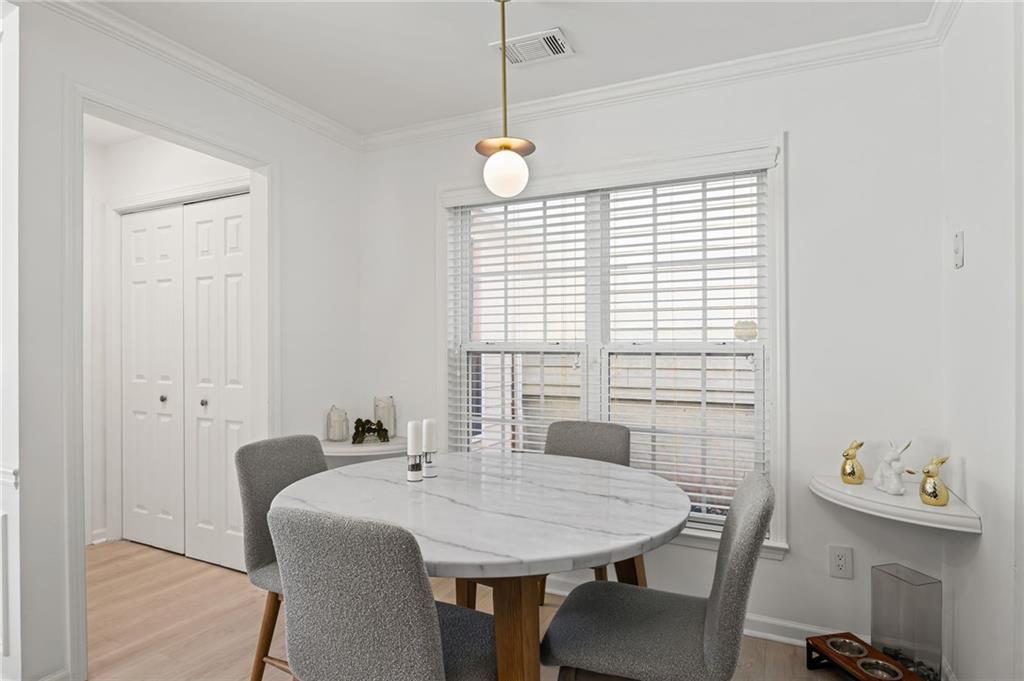 266 Balaban Circle Woodstock, GA 30188 - Photo 14 of 58 a view of a dining room with furniture and window