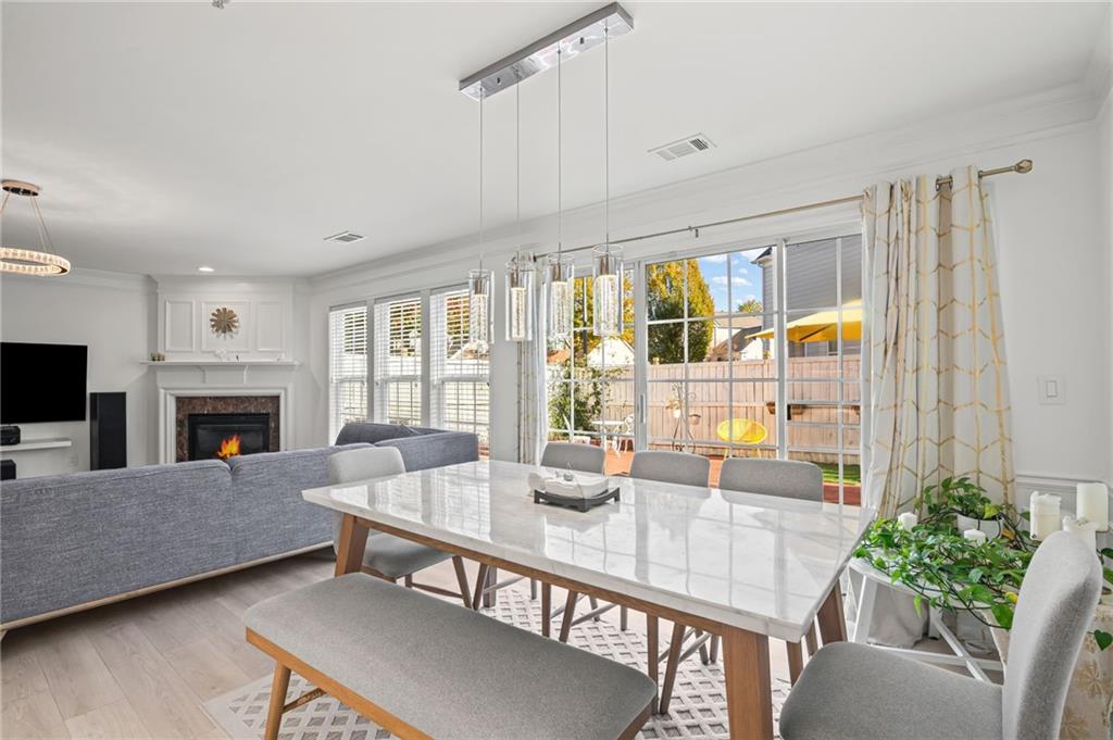 266 Balaban Circle Woodstock, GA 30188 - Photo 17 of 58 a living room with furniture a fireplace and a potted plants
