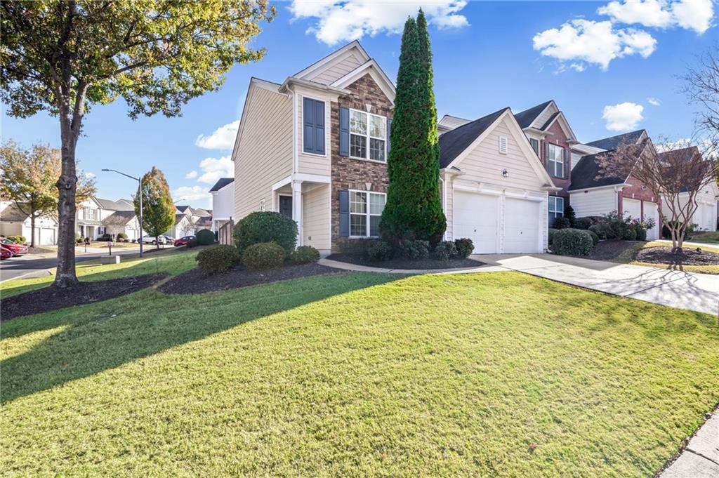 266 Balaban Circle Woodstock, GA 30188 - Photo 2 of 58 a front view of a house with a yard