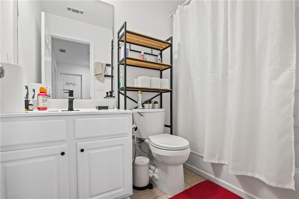 266 Balaban Circle Woodstock, GA 30188 - Photo 21 of 58 a bathroom with a sink toilet and a mirror