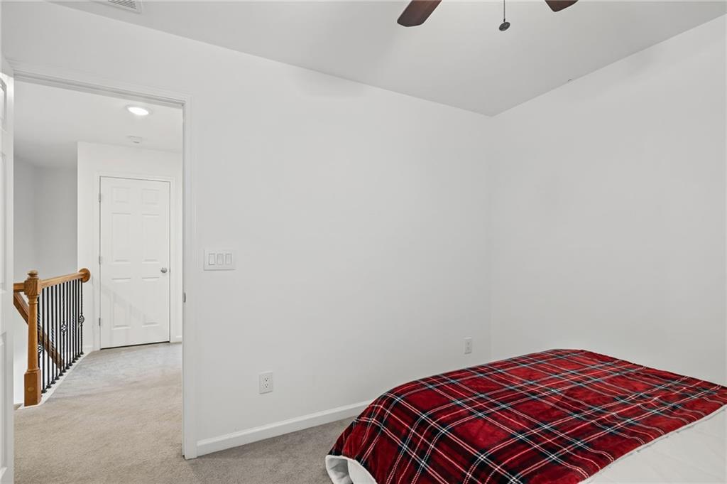 266 Balaban Circle Woodstock, GA 30188 - Photo 25 of 58 a bedroom with a bed and a dresser