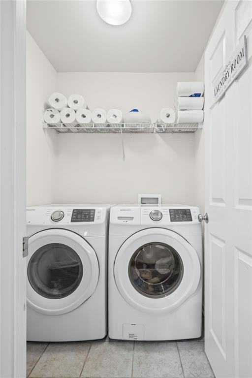 266 Balaban Circle Woodstock, GA 30188 - Photo 26 of 58 a utility room with dryer and washer