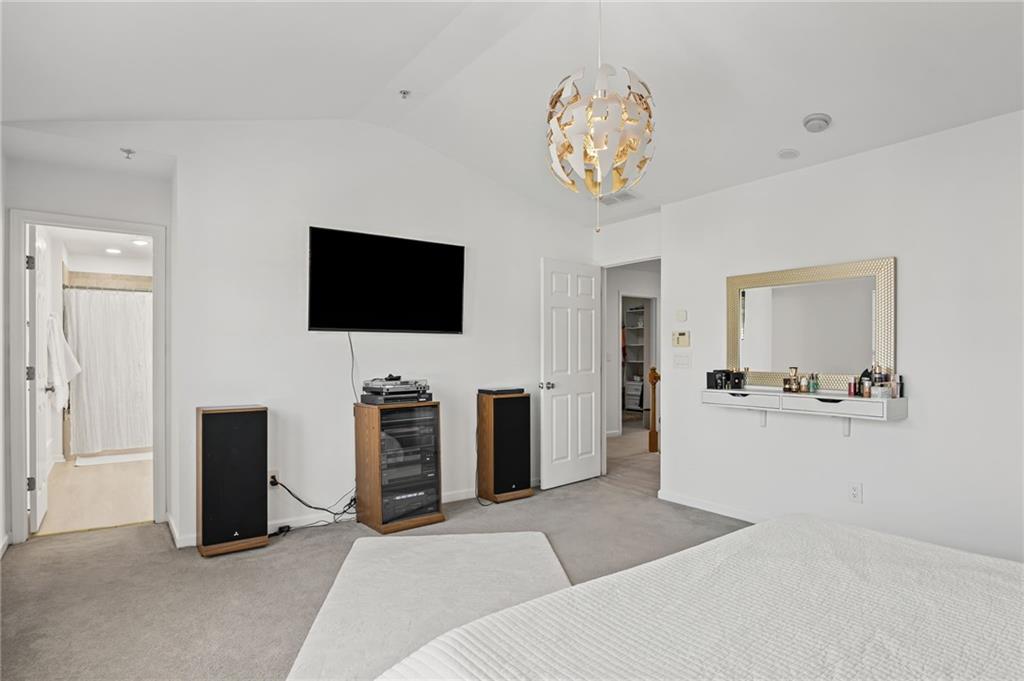 266 Balaban Circle Woodstock, GA 30188 - Photo 28 of 58 a view of a livingroom with furniture and a flat screen tv