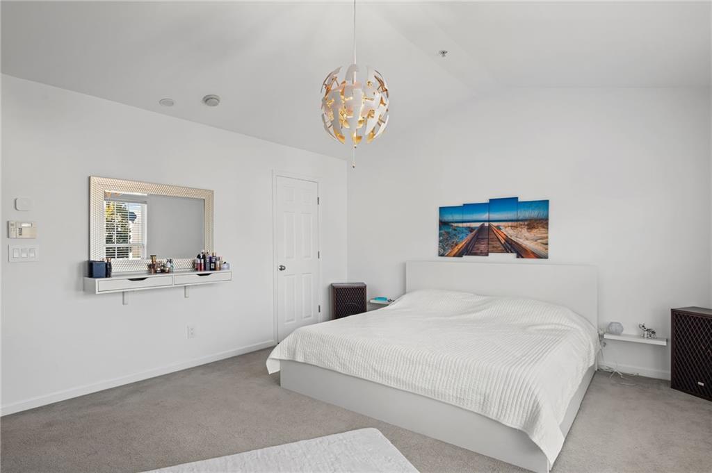 266 Balaban Circle Woodstock, GA 30188 - Photo 29 of 58 a bedroom with a bed and a table with chair