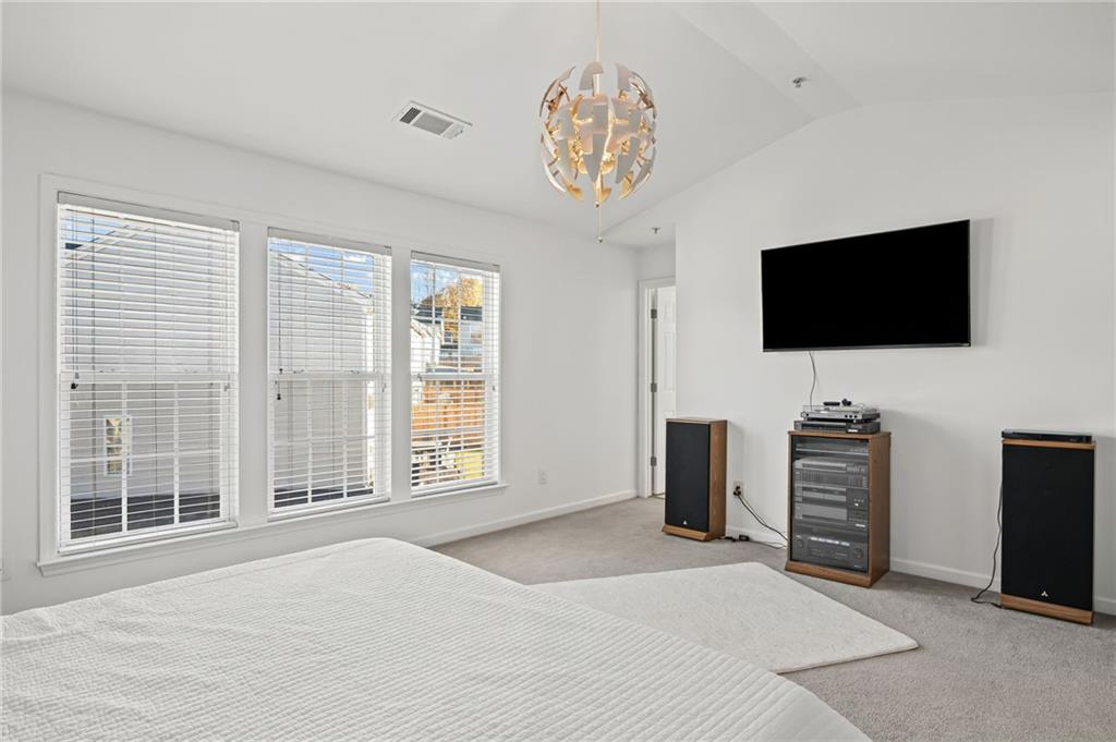 266 Balaban Circle Woodstock, GA 30188 - Photo 30 of 58 a view of a livingroom with furniture and a flat screen tv