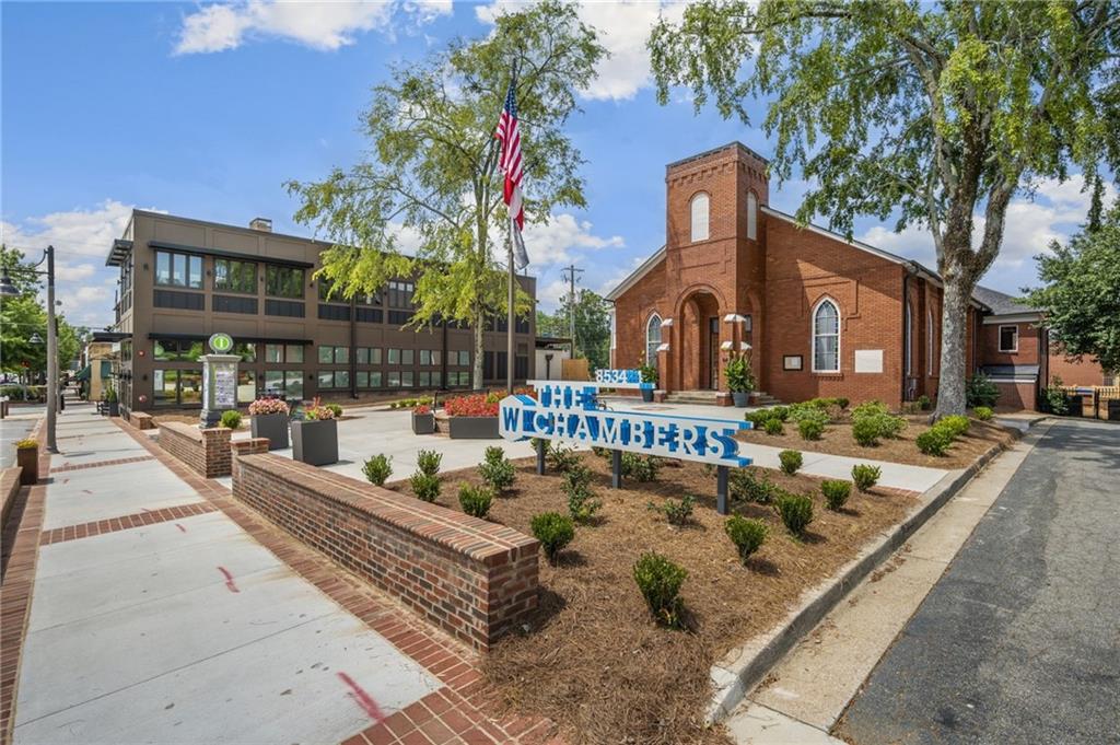 266 Balaban Circle Woodstock, GA 30188 - Photo 39 of 58 a front view of a house with fountain and tree s